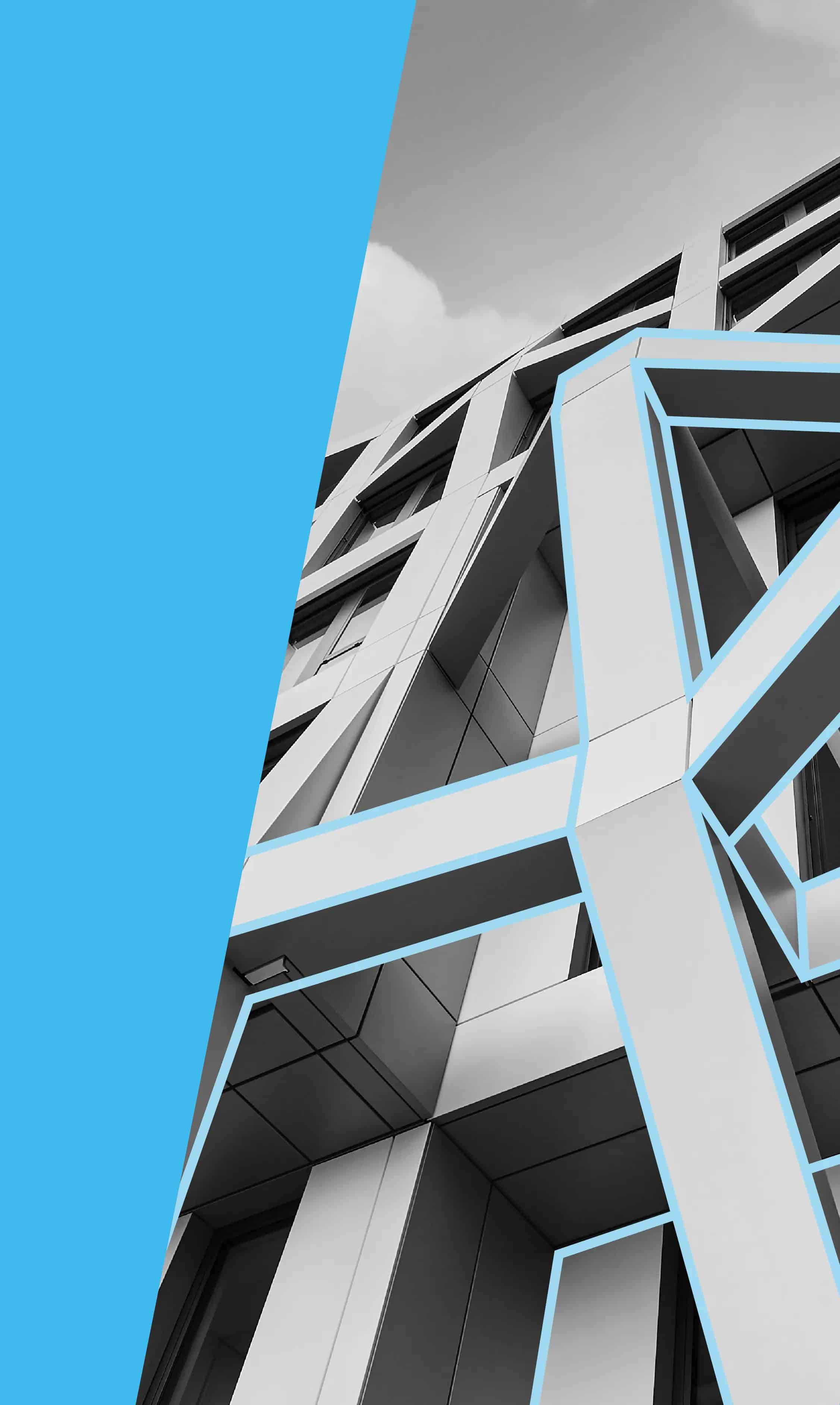 Modernes Gebäude mit geometrischem Design, teilweise in Schwarzweiß, vor hellblauem Hintergrund.